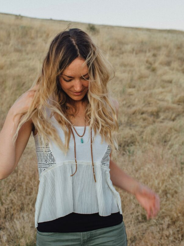girl in wheat field with boho wrap necklace